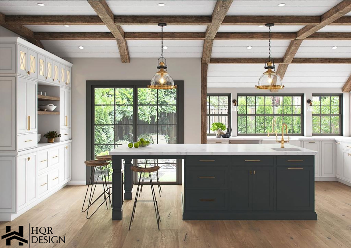 This is a photograph of a modern kitchen interior with dark cabinets, light countertops, exposed wooden beams on the ceiling, and large windows letting in natural light. The design includes a central island with barstools, a sink, and various decorative elements such as plants and artwork.
